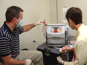 Tim trains patient on home dialysis machine by NXStage